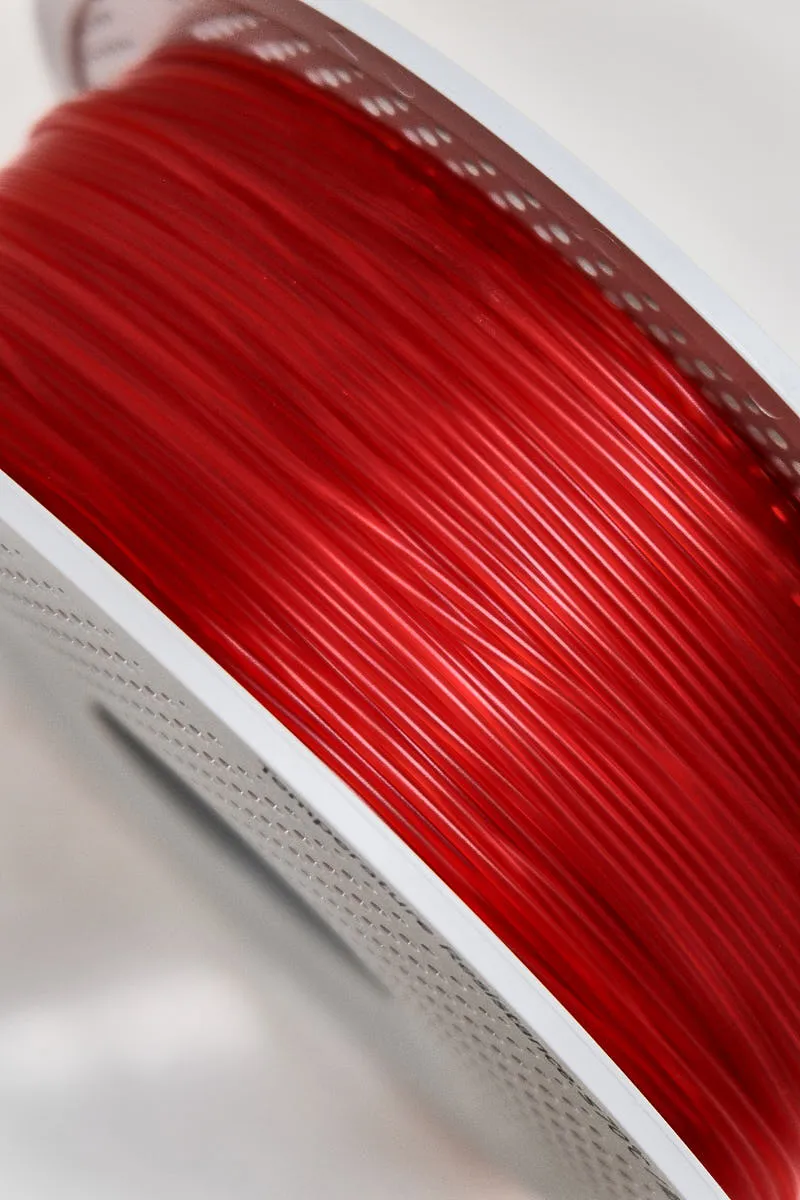 Close-up of Bambu Lab Translucent Red filament 13210 on spool, showing smooth surface, even diameter, and translucent red tone