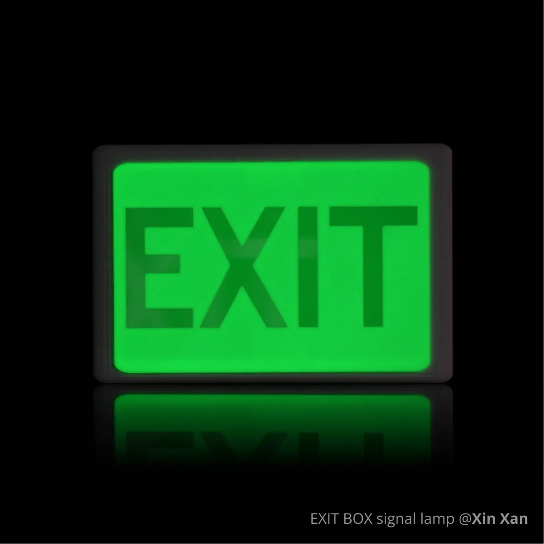 Glow-in-the-dark EXIT sign box 3D printed with Bambu PLA Glow filament, emitting bright green light in darkness