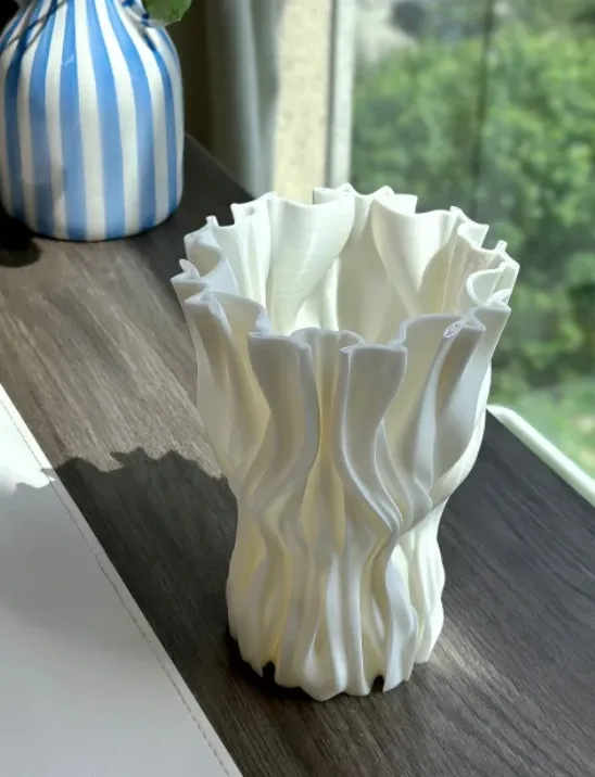 White decorative vase 3D printed with Creality Hyper Series PLA White filament 1.75mm, showing smooth surface and flowing texture details
