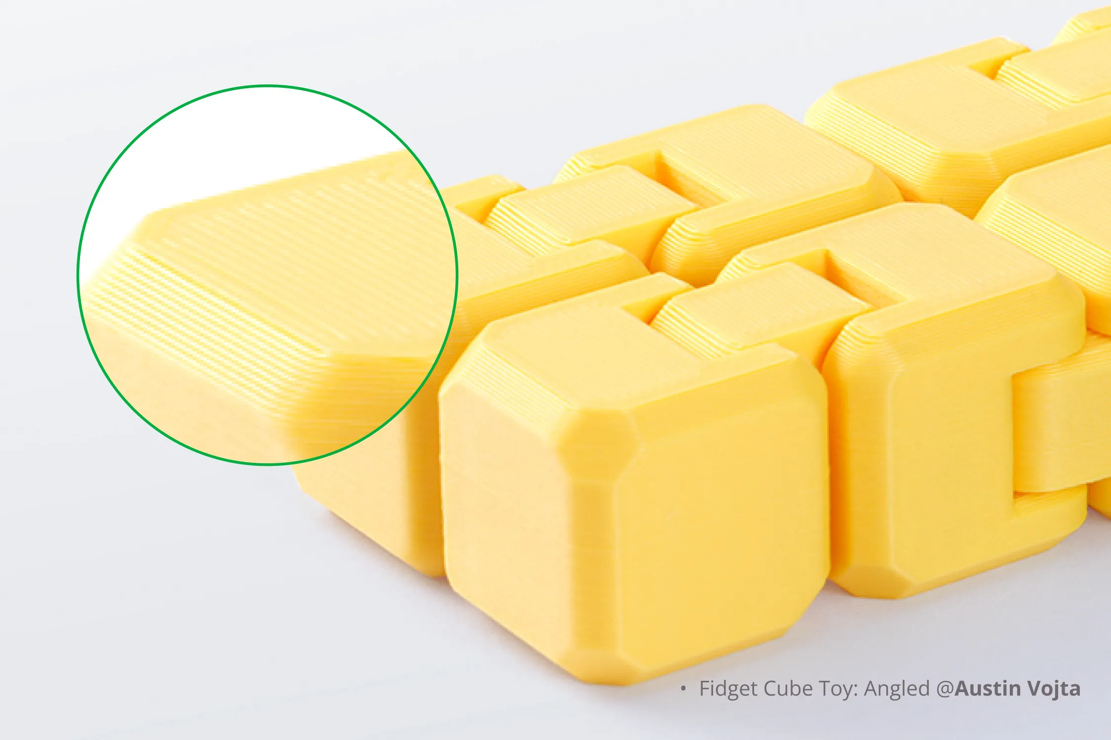 Close-up of a printed part bottom surface showing fine texture transferred from the Bambu Engineering build plate