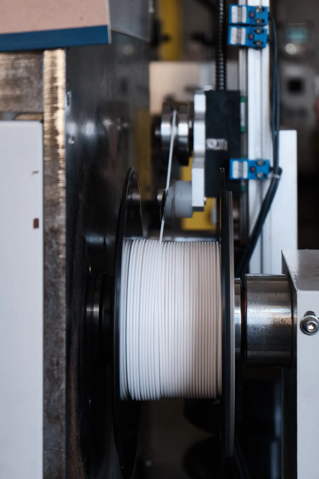 3D printing filament being wound onto spool during production at Voxelfuse3D factory