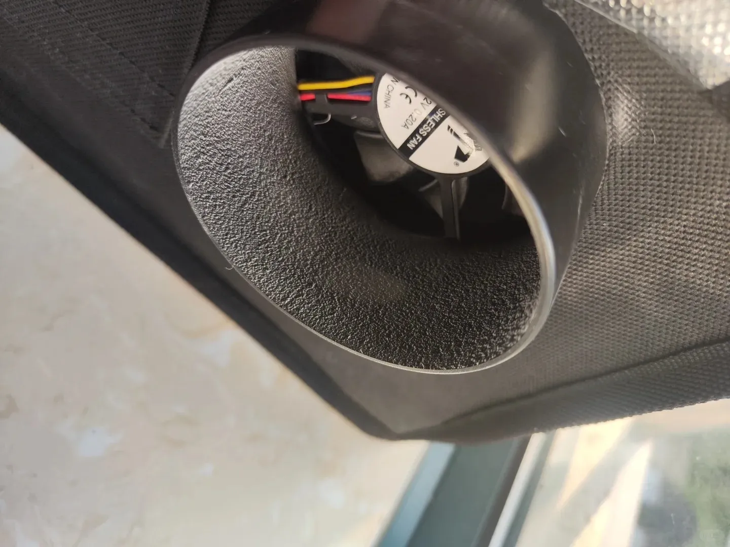 Close-up of inline fan mounted inside a flexible exhaust duct for 3D printer ventilation system