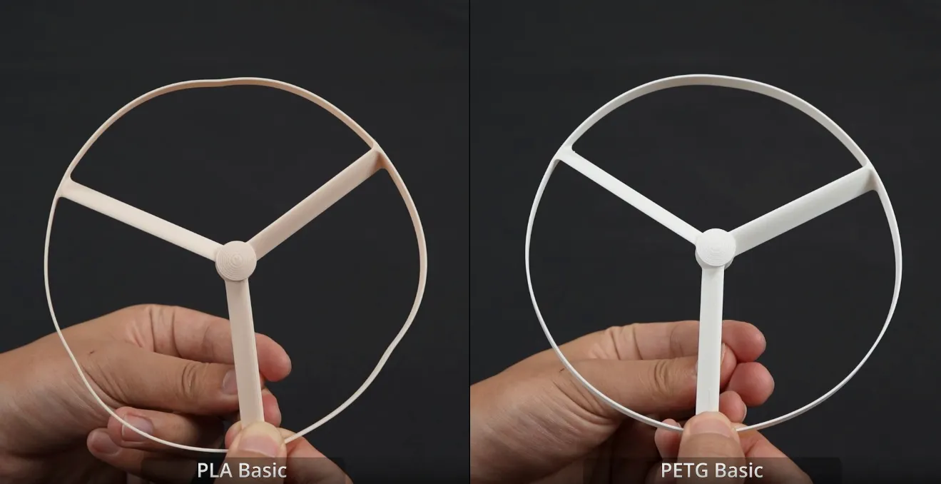 PLA Basic vs PETG Basic filament comparison showing structural deformation and rigidity difference