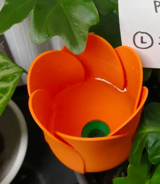 Decorative flower pot 3D printed with Bambu Lab PLA Lite Orange filament 16301, featuring smooth curved walls and vivid orange color
