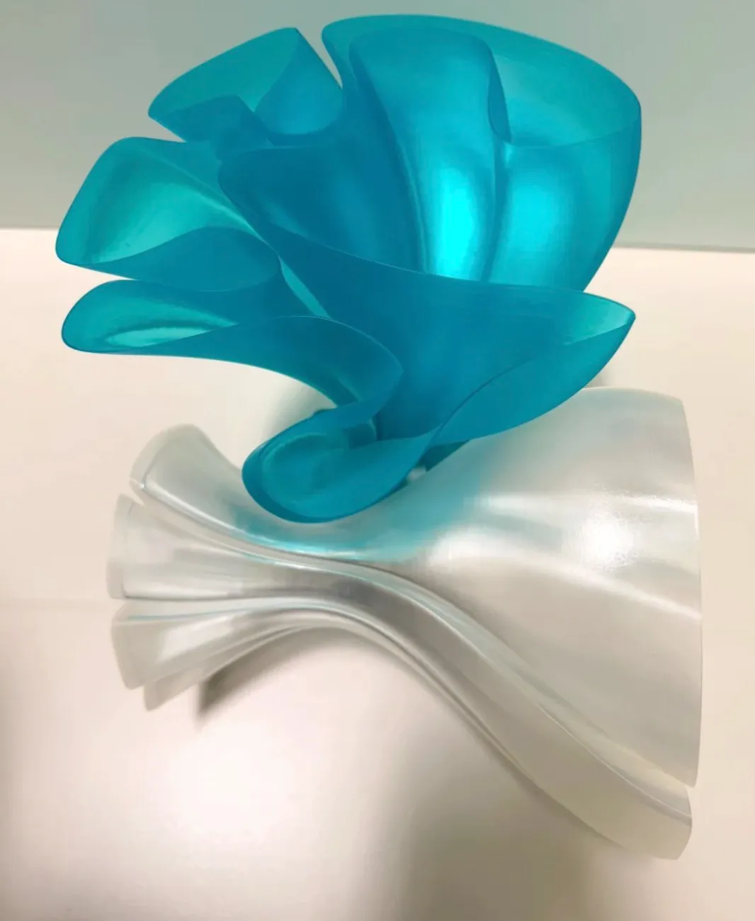 Official render of Bambu Lab PLA Translucent Teal Filament with Spool Color Code 13612 showing semi-transparent teal tone and smooth layered surface finish.