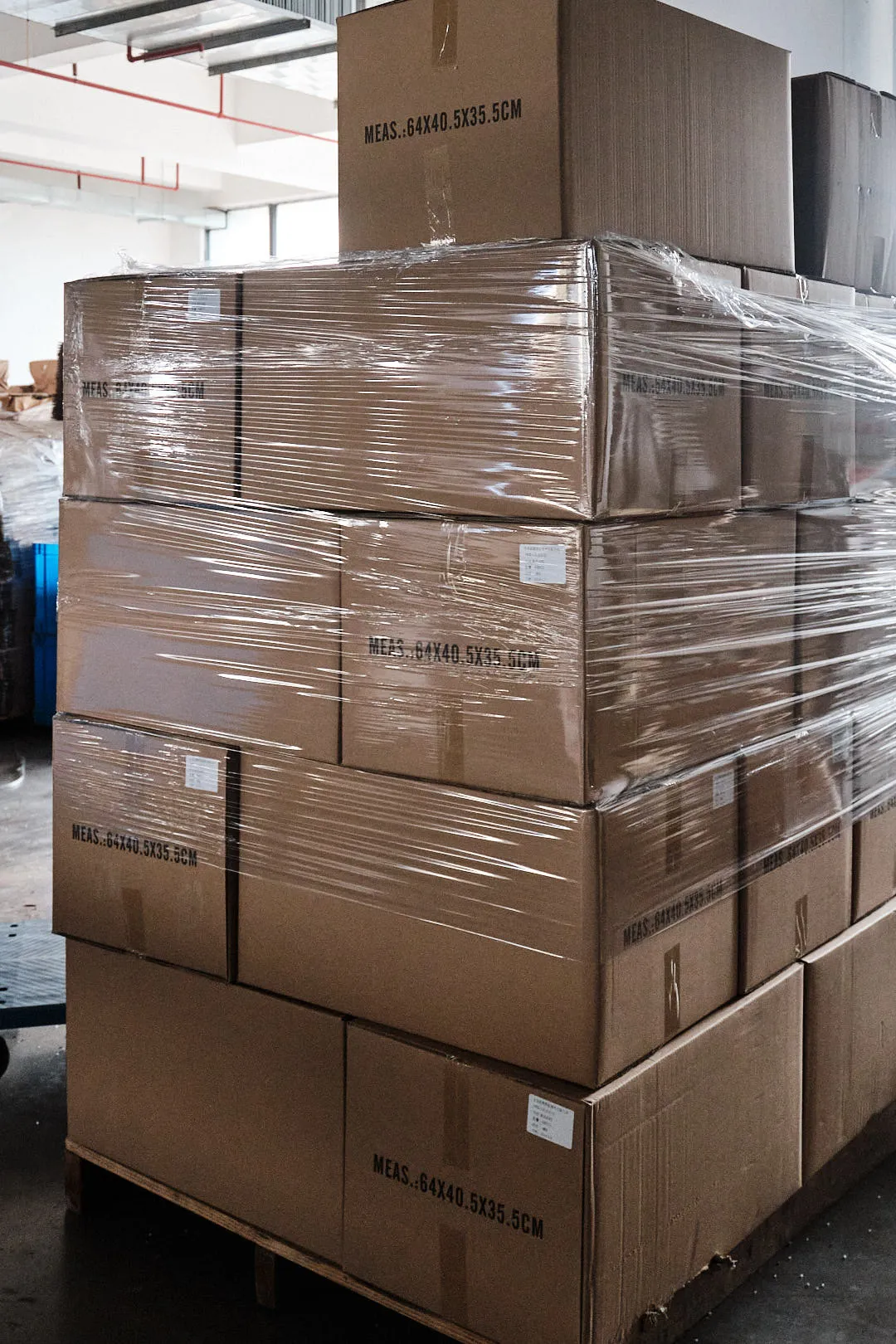 Palletized boxes of 3D printing filament prepared for wholesale distribution at Voxelfuse3D