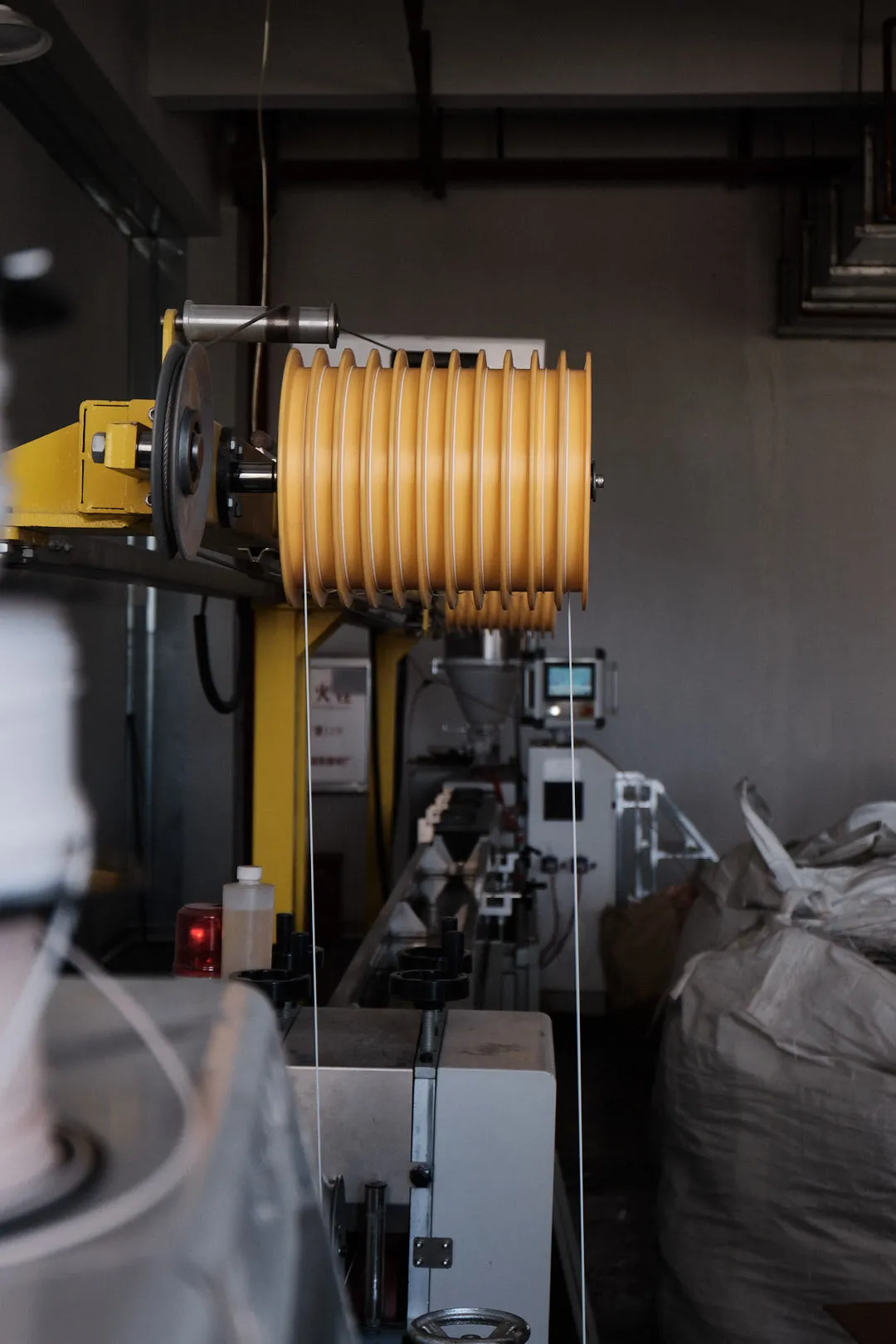 Parallel spooling system winding multiple 3D printing filament lines onto separate spools during production