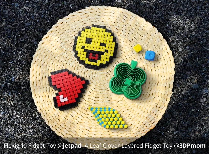 Pixel-style heart, smiley face, clover fidget toy and textured models printed using PLA Basic filament