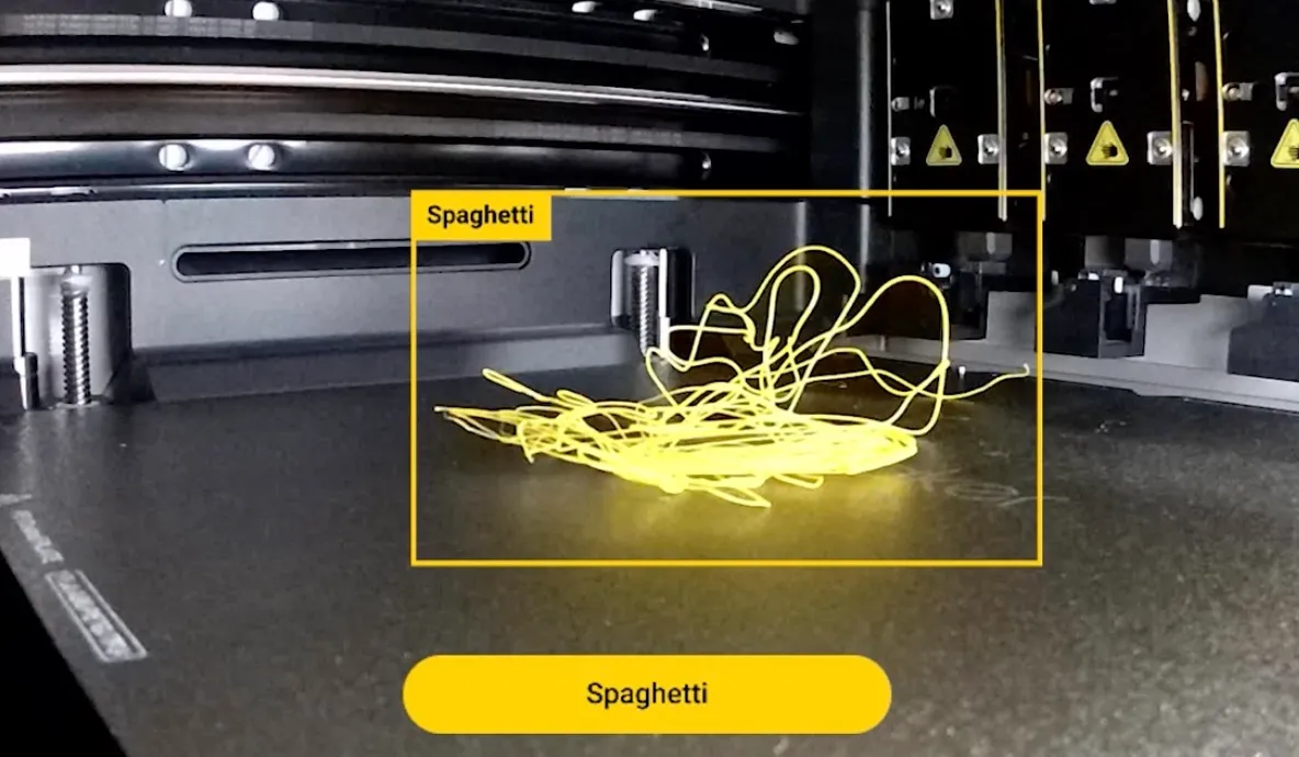 AI spaghetti detection identifying failed filament print on build plate