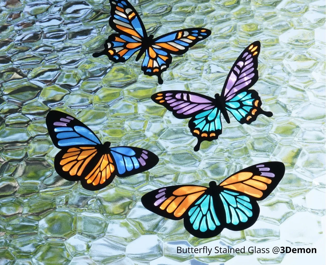Butterfly stained glass style 3D prints made with PLA translucent filament showing vibrant color transparency