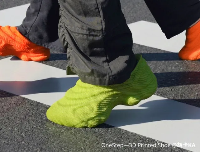 green and orange 3D printed shoes made with TPU 85A or TPU 90A flexible filament walking on pavement