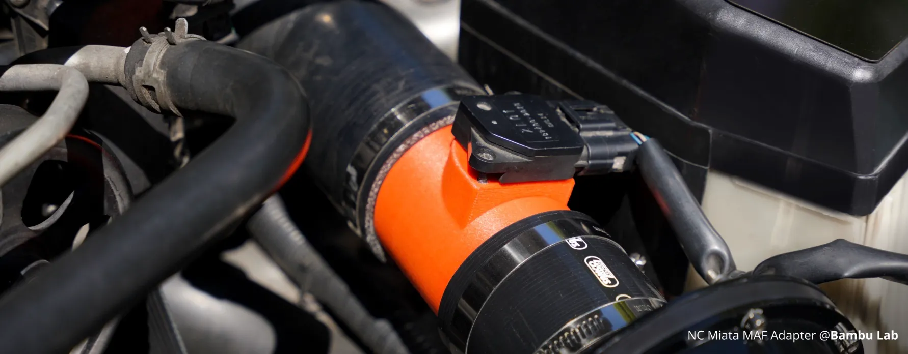 automotive MAF adapter 3D printed using Bambu Lab PA6-GF Filament installed in engine bay