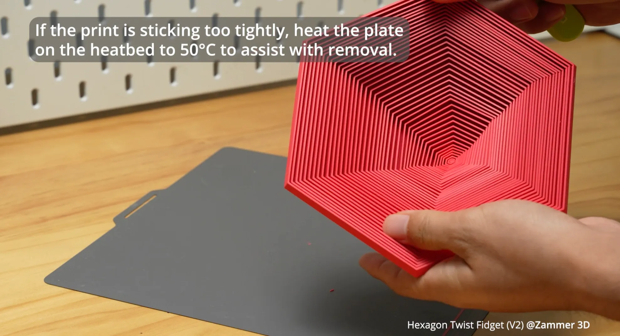 3D print removed from build plate after heating to 50 degrees Celsius for easier release