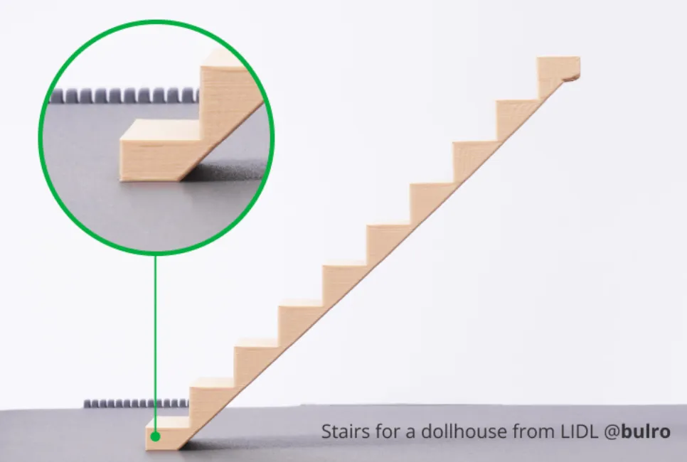 stair test model first layer adhesion detail on build plate showing clean edges and strong bonding