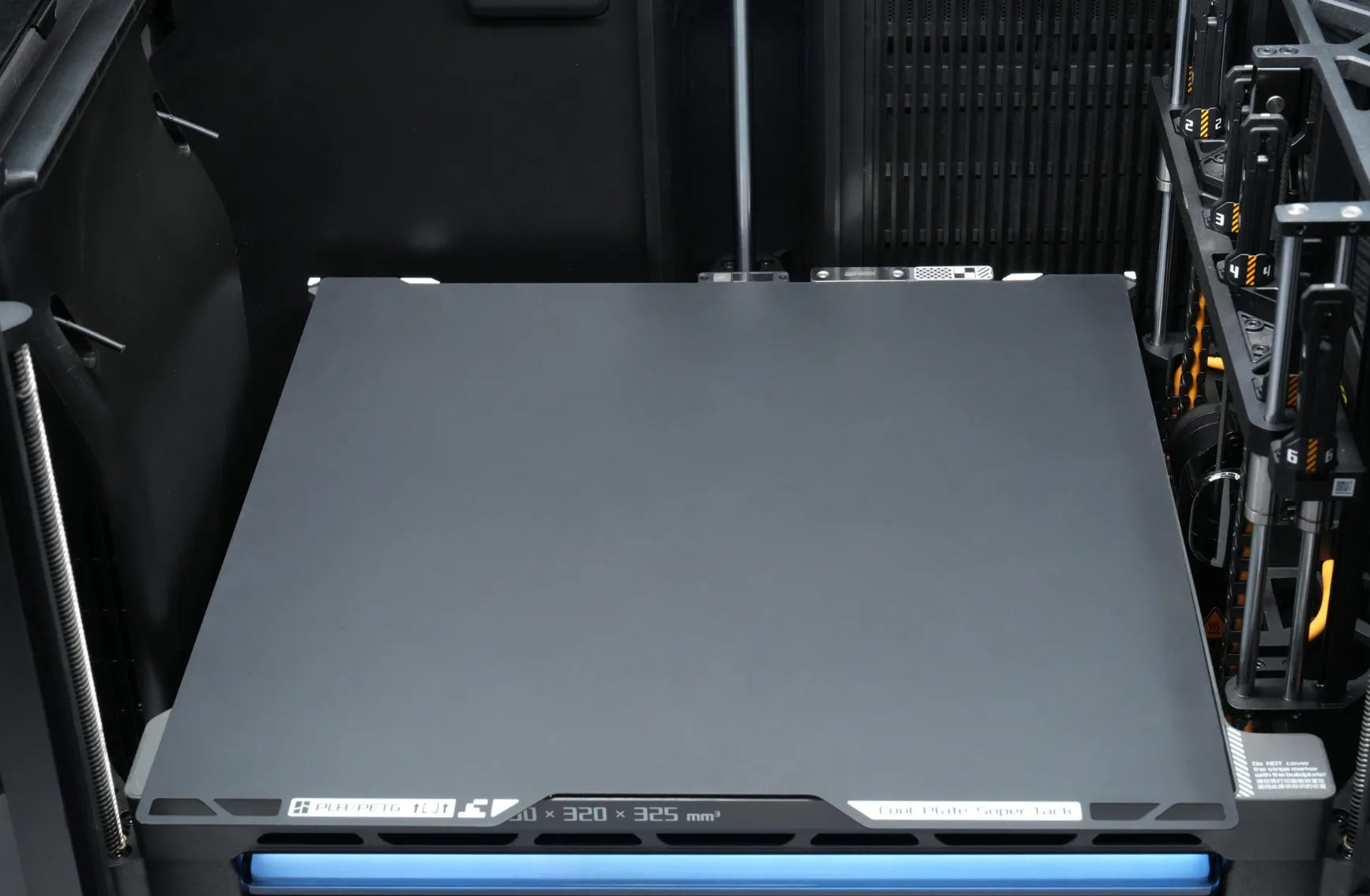 Aligning Bambu Cool Plate SuperTack Pro with fixed points on printer platform before securing to magnetic heatbed