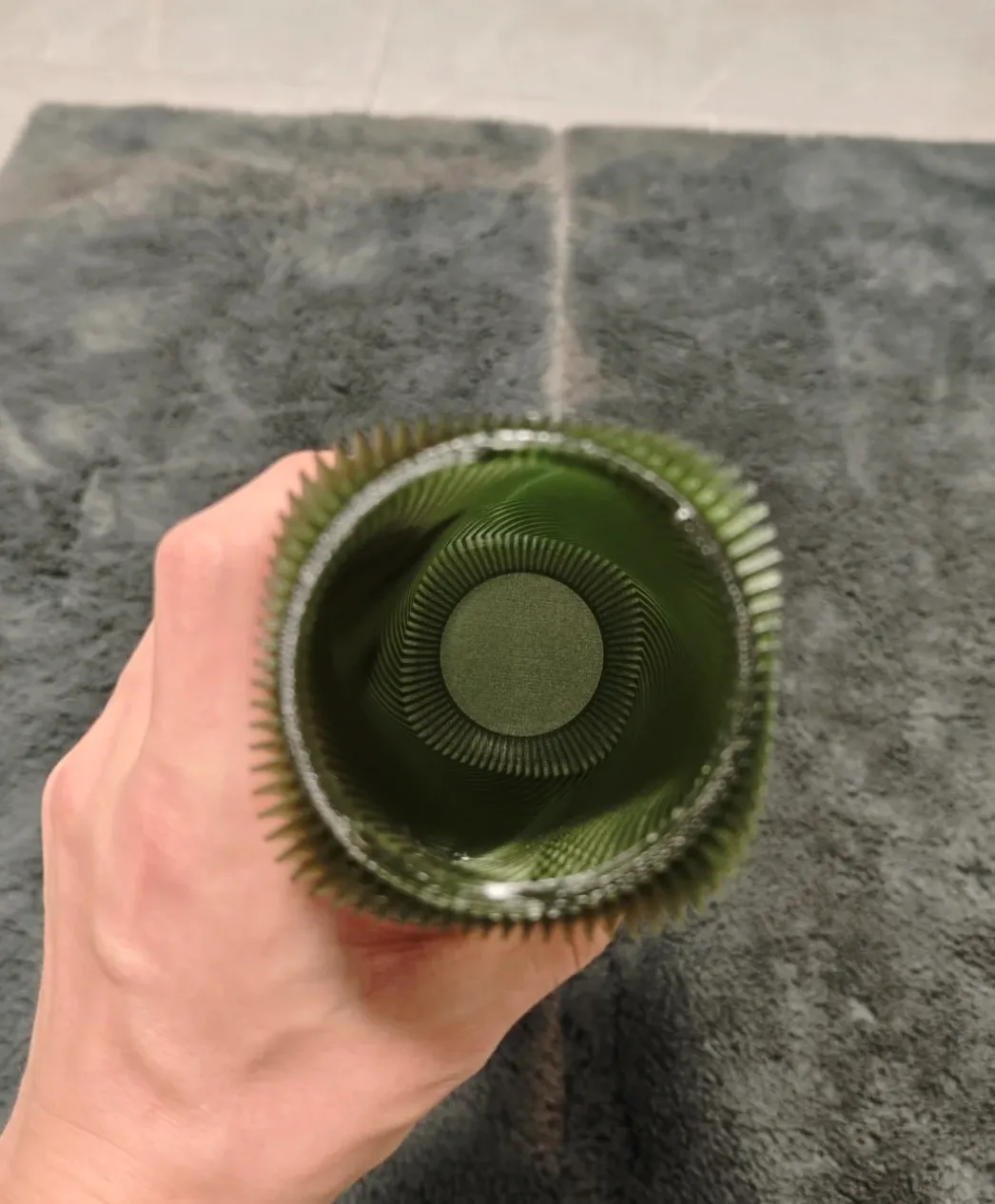 Top-down interior view of twisted cylindrical lamp shade printed with Bambu Lab PETG Translucent Olive Green Filament Color Code 32500.