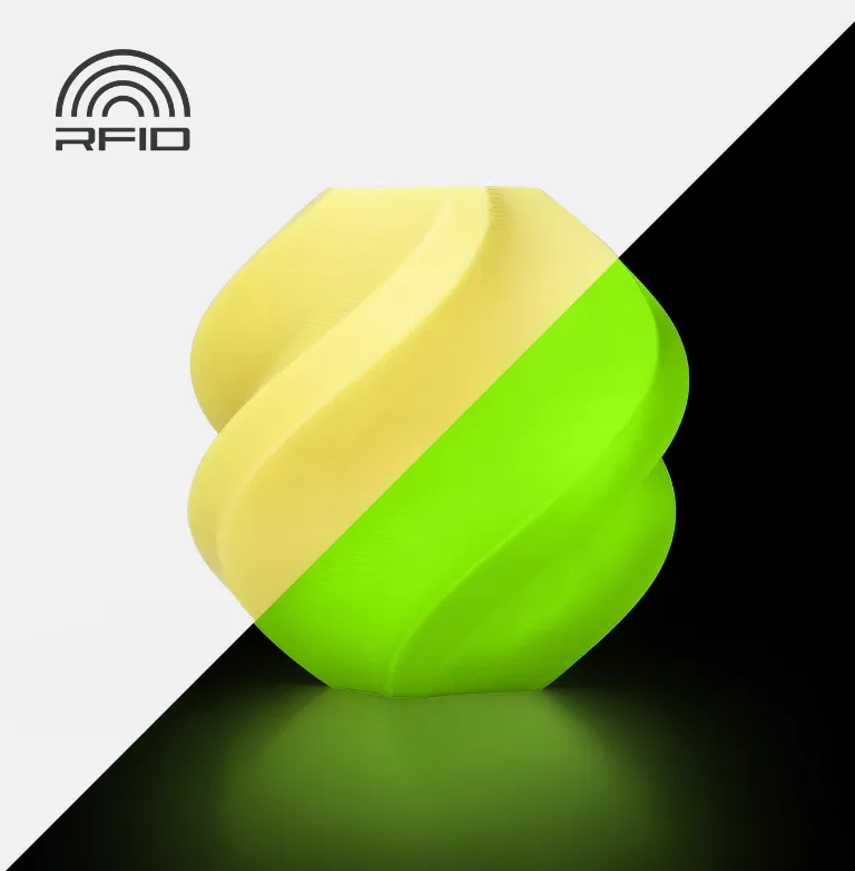 Spiral vase 3D printed with Bambu Lab PLA Glow Yellow Filament 1.75mm 1kg/Spool (Color Code:15400), showing yellow surface in normal light and bright greenish glow effect under low light with RFID icon