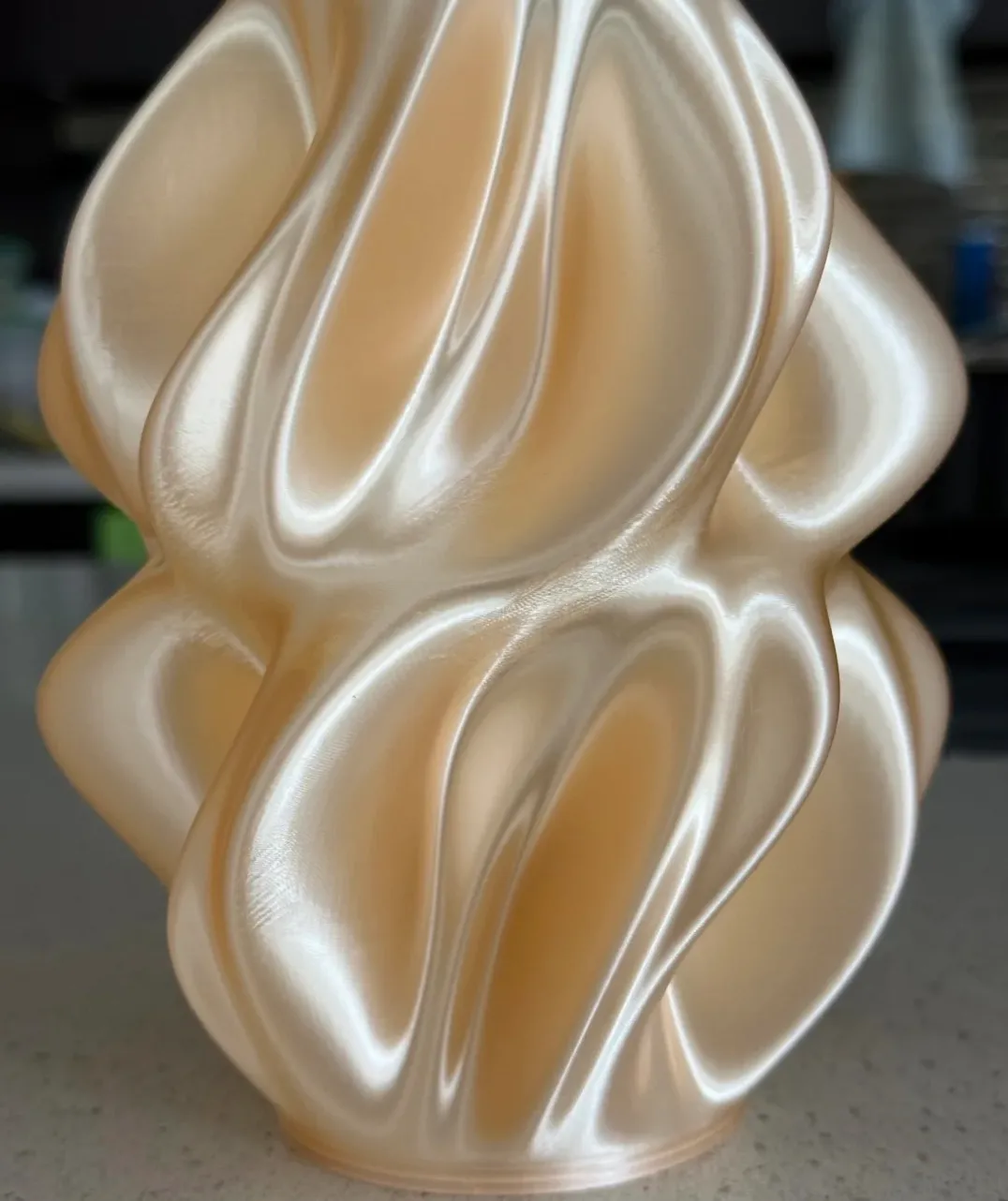 Abstract sculptural vase printed with Bambu Lab PLA Silk+ Champagne Filament 1.75mm 1kg spool (Color Code 13404), showing smooth silk metallic surface and soft champagne sheen.