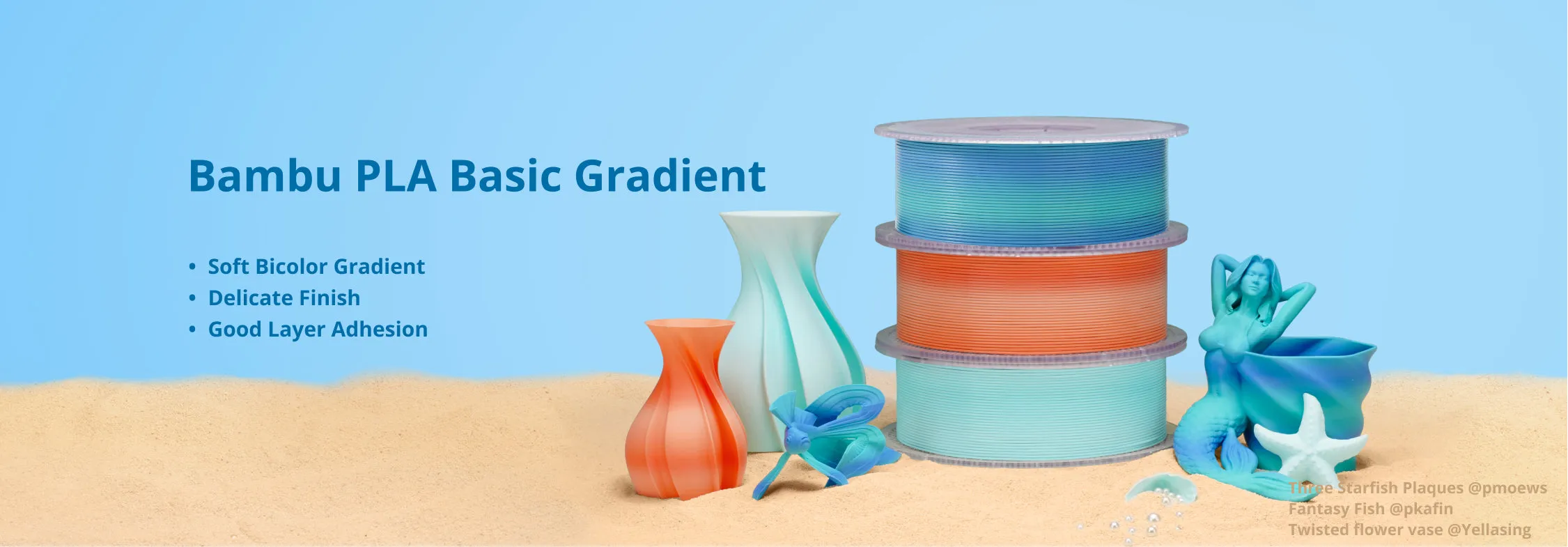 Bambu PLA Basic Gradient filament spools and printed models displayed on sand background