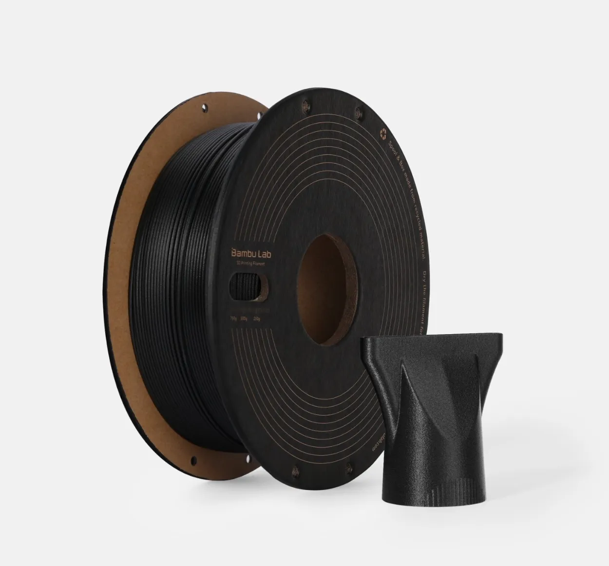 Bambu Lab PPA-CF Black Filament spool with 3D printed component made using carbon fiber reinforced 3D printing filament Color Code 73100