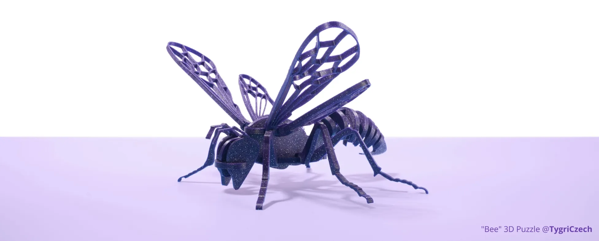 bee shaped puzzle model 3D printed with Bambu PLA Spark filament showing glitter texture