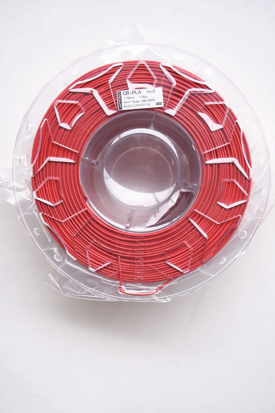 top view of Creality CR-PLA Carbon Red filament 1.75mm 1kg inside transparent packaging
