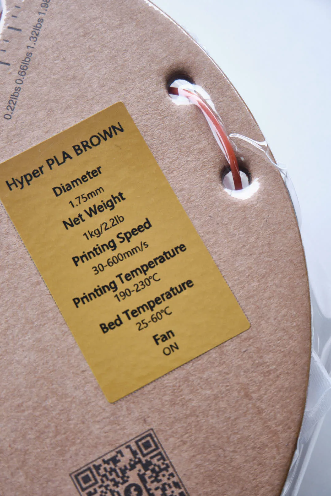 Specification label on Creality Hyper Series PLA Brown filament spool showing diameter 1.75mm and net weight 1kg