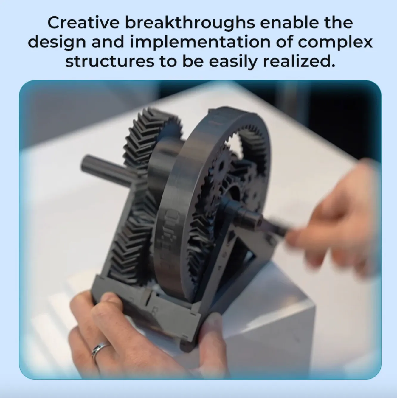 Creality Hyper PLA-CF Filament printed gear mechanism model held and rotated by hand