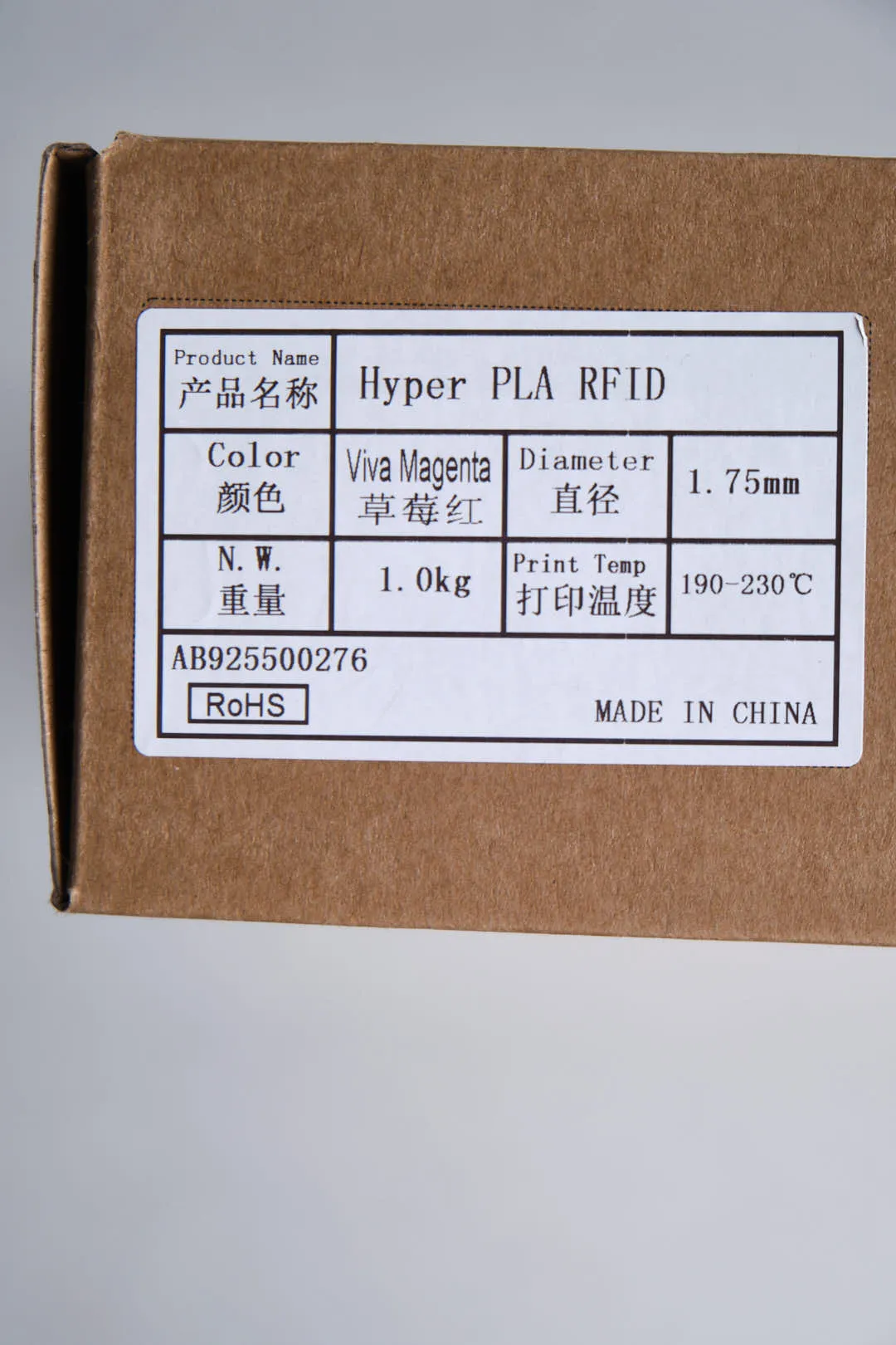 Close-up of Creality Hyper PLA RFID Viva Magenta filament packaging label showing color, diameter 1.75mm and print temperature