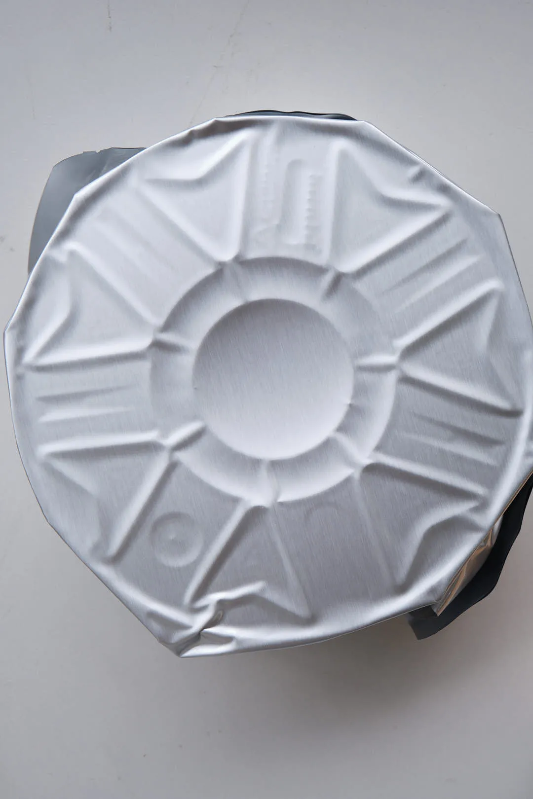 Back view of vacuum sealed foil packaging for Creality Hyper PLA RFID filament showing sealed surface texture