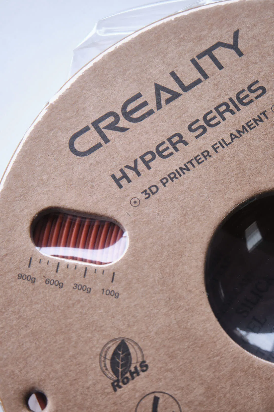Creality Hyper Series logo and filament weight indicator window on PLA Brown filament spool