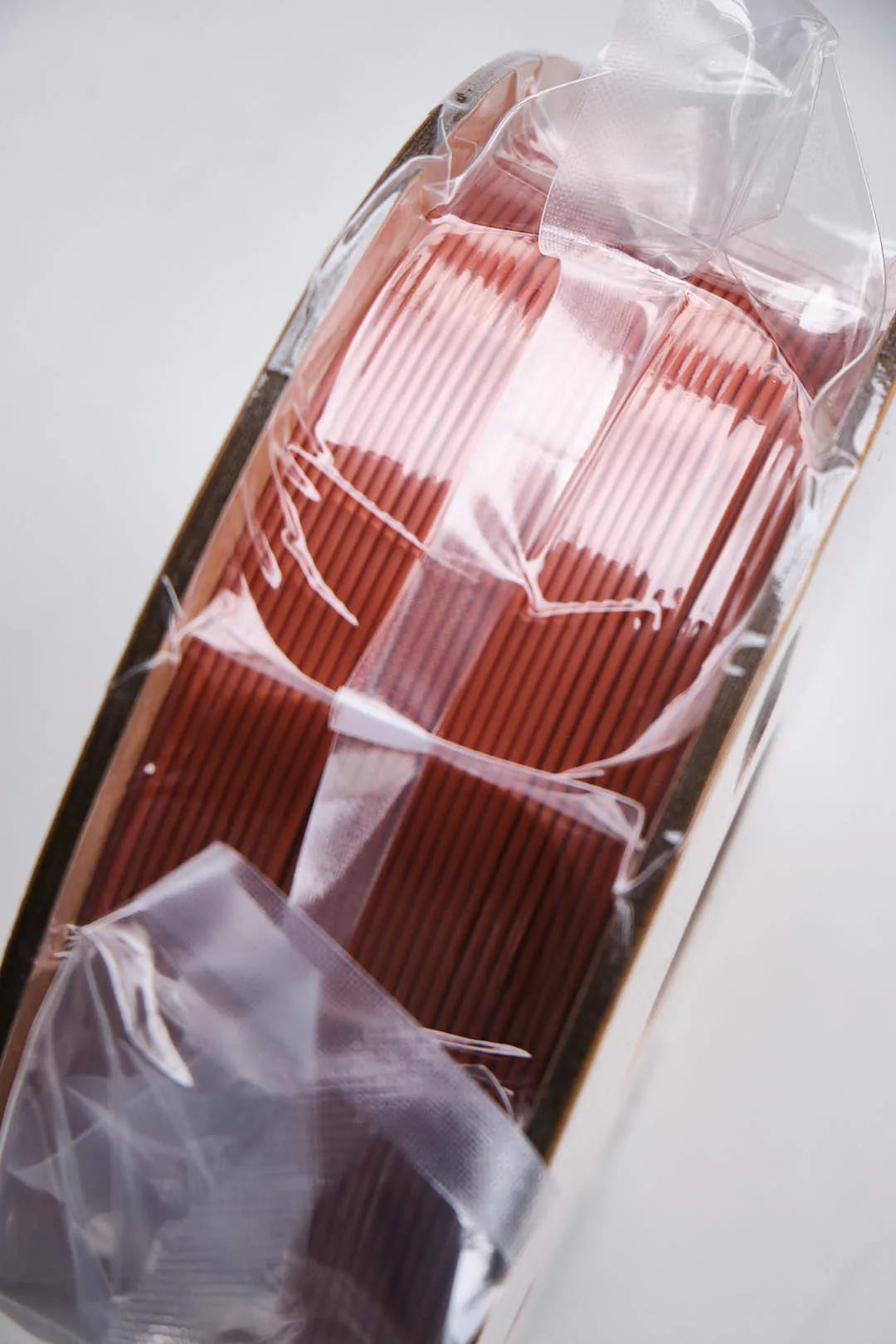 Brown Creality Hyper Series PLA filament spool inside transparent vacuum packaging