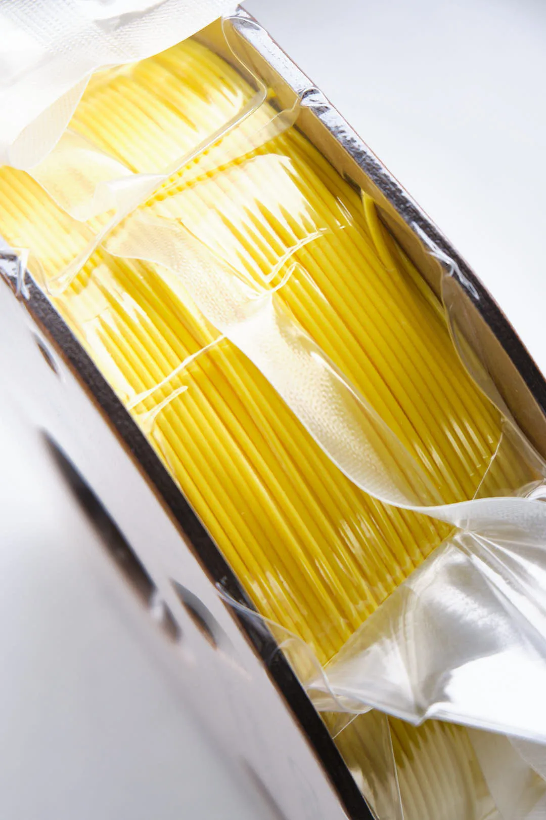 Close up of Creality Hyper Series PLA Yellow filament 1.75mm 1kg inside vacuum bag