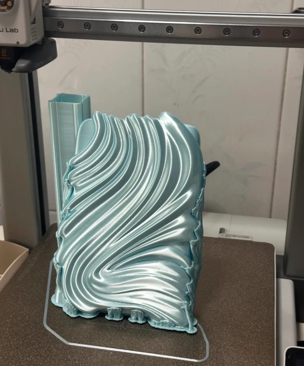 3D printed decorative panel on build plate using Bambu Lab PLA Silk+ Baby Blue Filament 1.75mm 1kg/Spool Color Code 13603