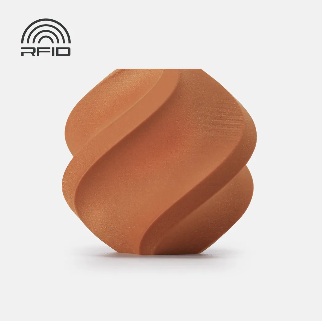 Decorative spiral container 3D printed using Bambu Lab PLA Metallic Copper Filament with Spool showing smooth metallic copper PLA surface