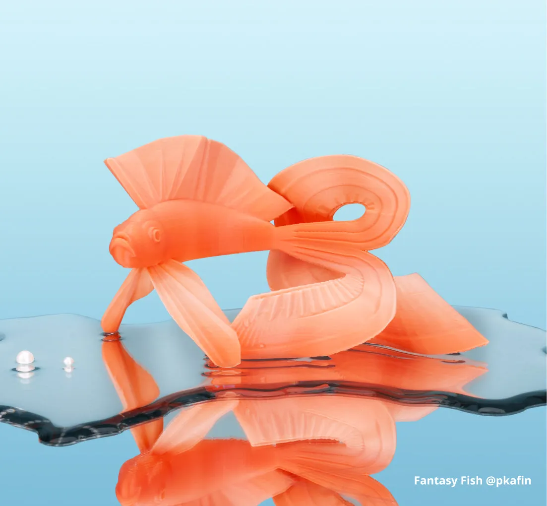 fantasy fish model printed in orange gradient PLA filament showing translucent layer structure