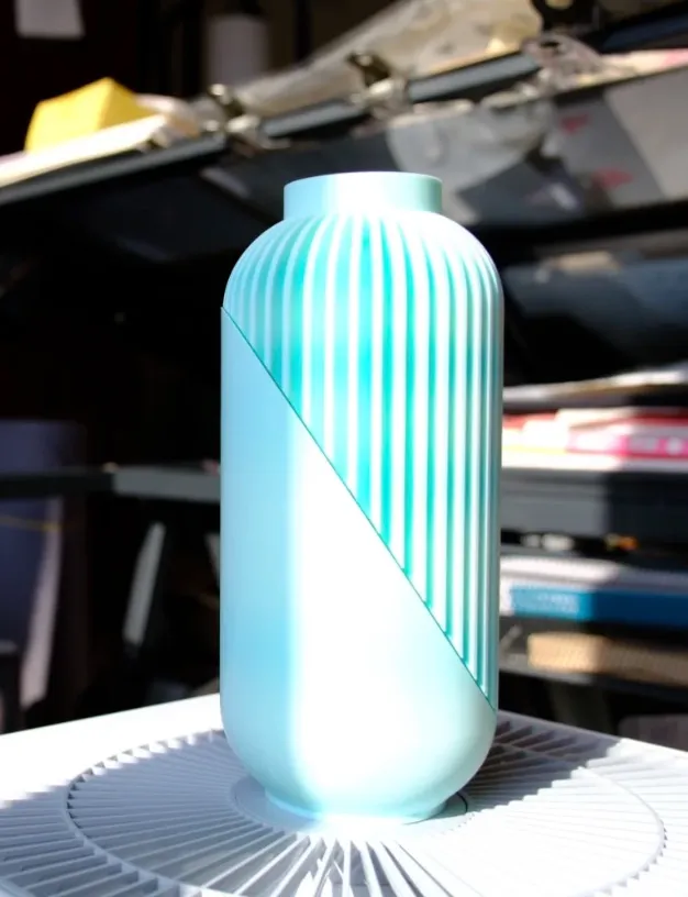 Gradient pattern vase printed using Bambu Lab PLA Basic Gradient Arctic Whisper Filament with Spool Color Code 10900 showing diagonal gradient transition and detailed ribbed texture