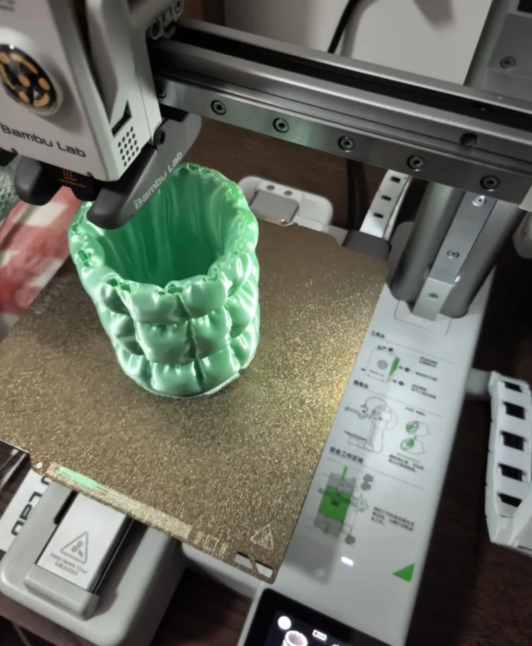 3D printer actively printing decorative vase using Bambu Lab PLA Silk+ Mint Green Filament 1.75mm 1kg/Spool Color Code 13507