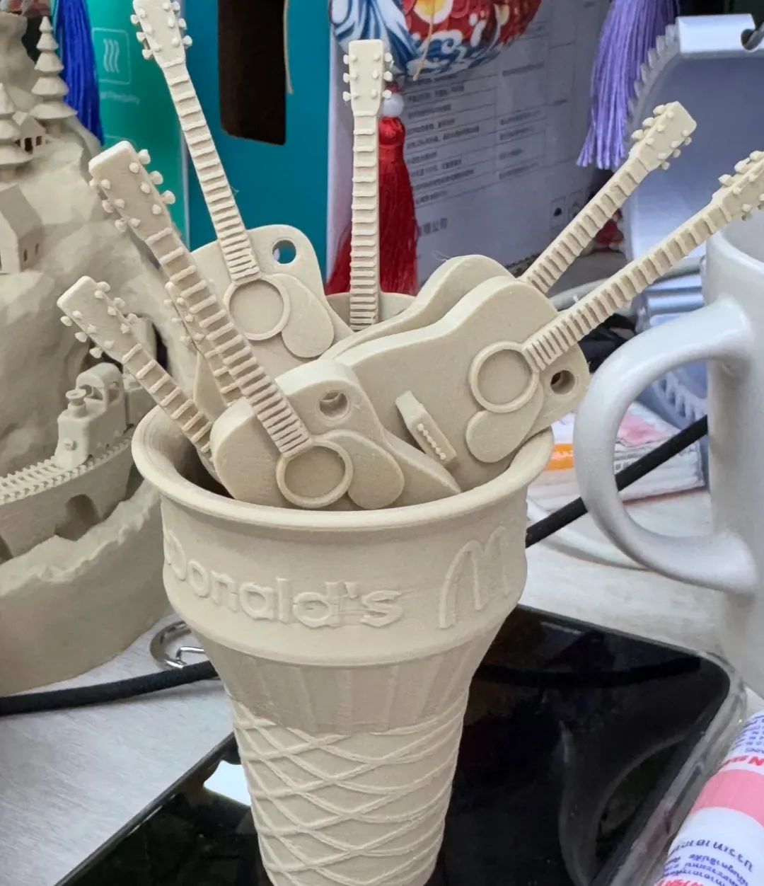 Mini guitar decorative models 3D printed using Bambu Lab PLA Wood White Oak Filament with Spool Color Code 13106