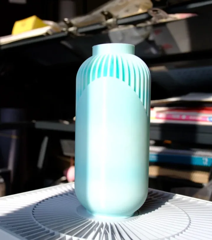 Modern decorative vase printed using Bambu Lab PLA Basic Gradient Arctic Whisper Filament with Spool Color Code 10900 showing smooth cylindrical geometry and soft gradient tones