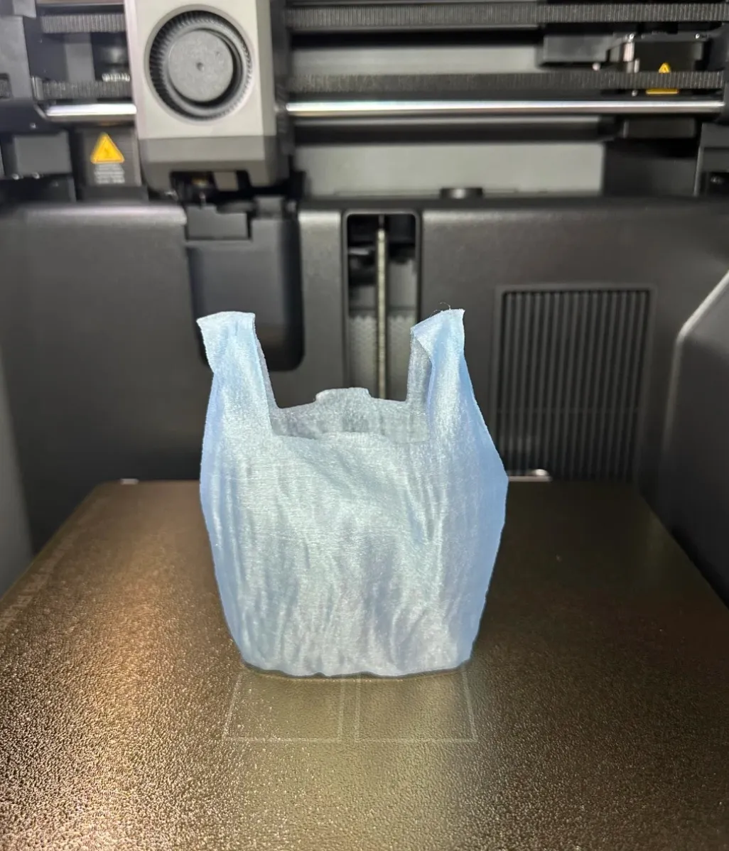 Decorative container printed on an FDM 3D printer using Bambu Lab PLA Translucent Ice Blue Filament with Spool 13610 showing consistent extrusion and clean base layer.
