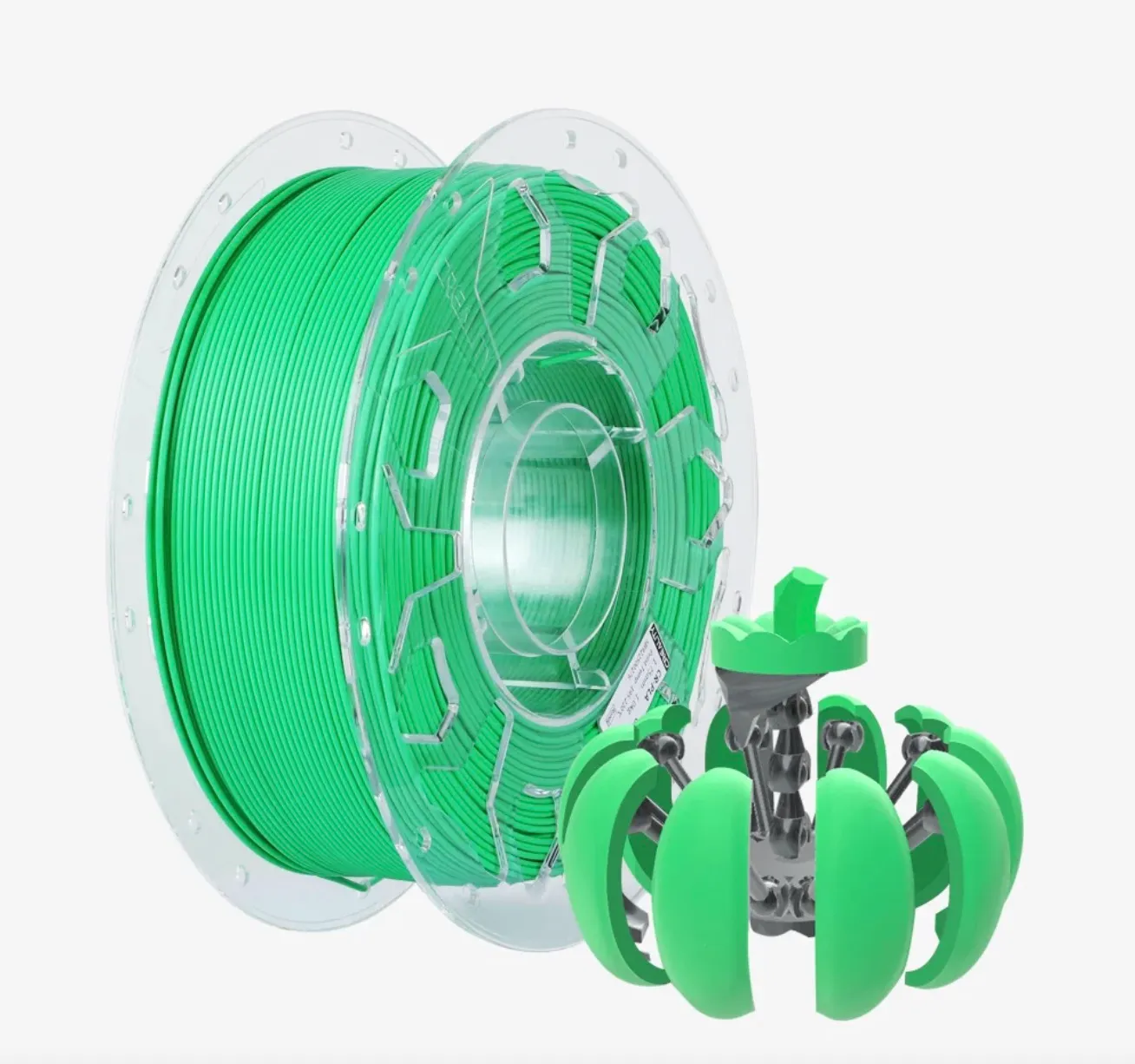green PLA filament spool with small green and gray 3D printed object placed in front
