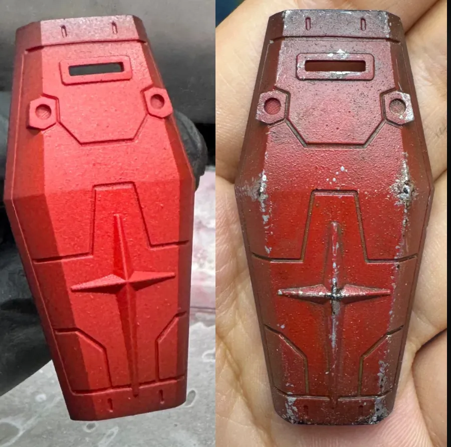 3d printed model comparison before and after weathering showing clean red surface and worn aged texture with scratches