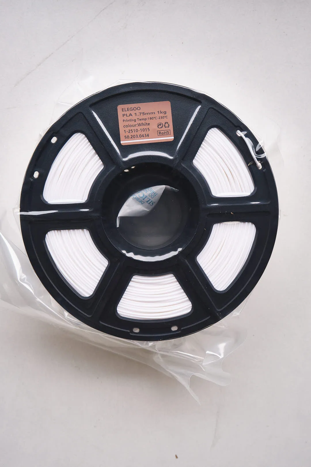 Elegoo PLA white filament 1.75mm 1kg spool sealed in plastic bag with label visible