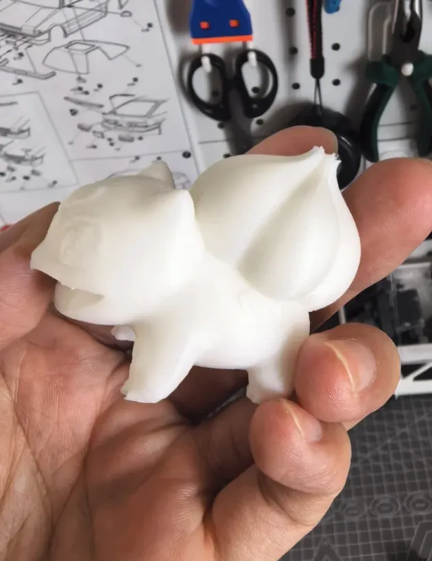 raw PLA 3D printed model with visible layer lines before sanding and painting